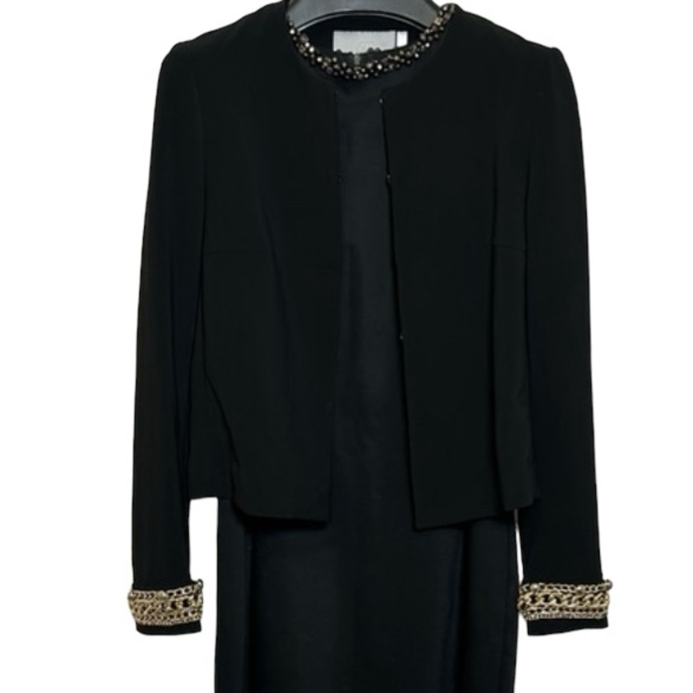 H&M size 2 black blazer, sleeves with metal decor.